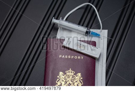 Covid-19, Travel And Lockdown Concept,passport With Covid-19 Rapid Test And Syringe For Vaccination
