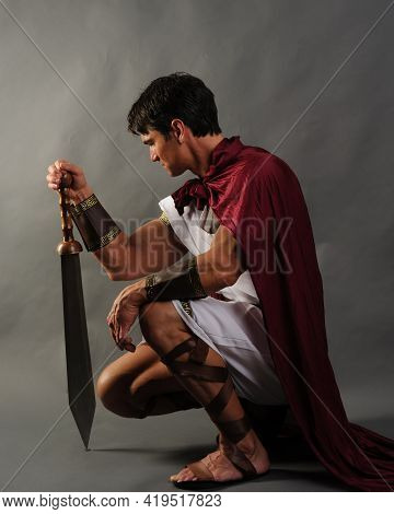 The Sexy Medieval Soldier Poses For The Photo.