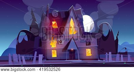 Fire In House At Night, Burning Suburban Cottage With Flame In Windows. Long Blaze Tongues Raging Ov