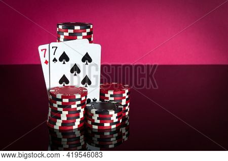 Poker Cards With One Pair Combination. Close-up Of Playing Cards And Chips In Poker Club. Free Adver