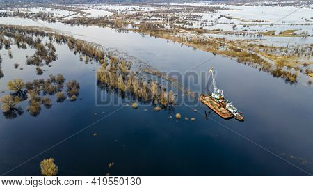 Dredger Is Working To Deepen The Fairway On The River. Cleaning And Deepening By A Dredger On The Ri