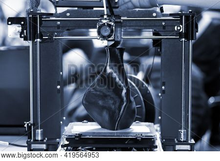 3d Printer Printing A Model In The Form Of Black Vase Close-up.