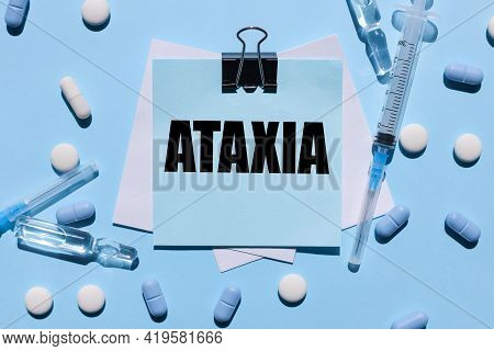 Ataxia. Stickers Are Clamped. On A Blue Background. Black Lettering Text On Blue Sticker
