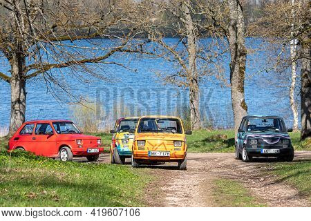 Koknese, Latvia - May 01, 2021: Several Colorful Oldtimer Pancars Rental Cars Fiat 126 Parked On The
