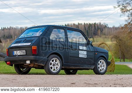 Madona, Latvia - May 01, 2021: Colorful Oldtimer Pancars Rental Car Fiat 126 Parked On The Side Of A