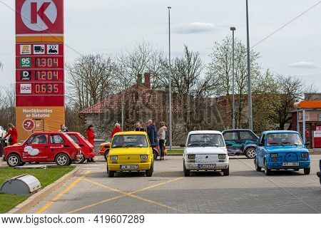 Gulbene, Latvia - May 02, 2021: More Colorful Vintage Cars Fiat 126 Gathered At The Gas Station, A F