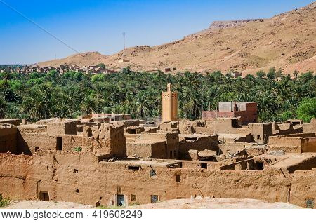 Aoufous, Morocco - April 17, 2015. Traditional Muddy Houses By Palm Oasis Around River Ziz
