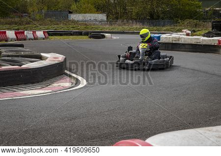 A Shot Of A Racing Kart As It Circuits A Track.