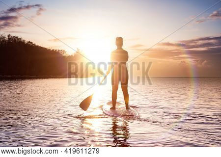 Adventurous Girl On A Paddle Board Is Paddeling In The Pacific West Coast Ocean. Sunset Sky Art Rend