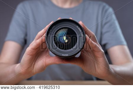 Modern Digital Camera Lens In Hands Of Female Photographer