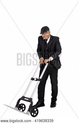 A Happy Businessman Using A Wheelbarrow Isolated White..in Full With Cllpping Parh