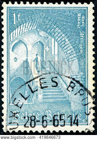 Belgium  - Circa 1960: Stamp Printed By Belgium, Shows   The Convent Affligem Interior Priest Climbi