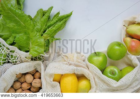 Eco Shopping Bags.farmed Organic Fruits And Vegetables. Reusable Eco-friendly Bags. Green Apples,man