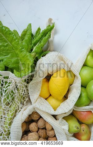 Eco Shopping Bags.farmed Organic Fruits And Vegetables. Reusable Eco-friendly Bags. Green Apples,man