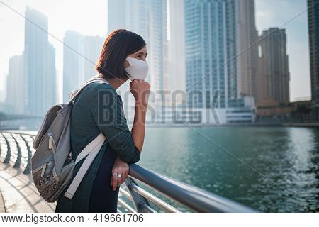Happy Young Female Traveler In The Big City Of Dubai, Uae