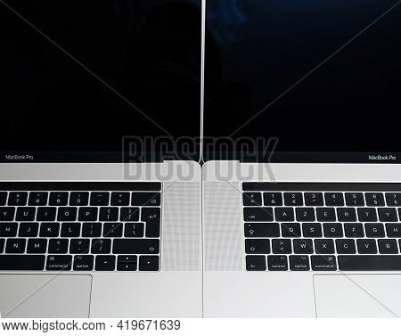 London, United Kingdom - Jan 9, 2018: Front View Of Two New Professional Apple Macbook Pro 16 15 Lap