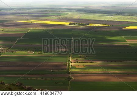 Aerial View Of Yellow And Green Rape Fields In Macin, Romania