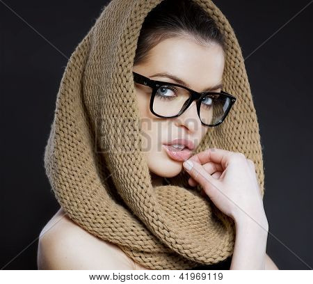 Attractive woman with a hood and glasses