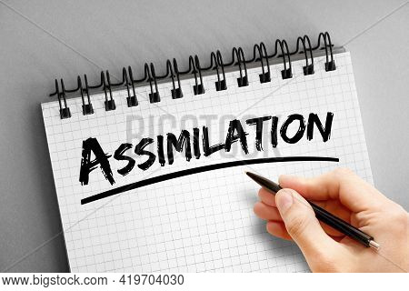 Assimilation - Text On Notepad, Concept Background