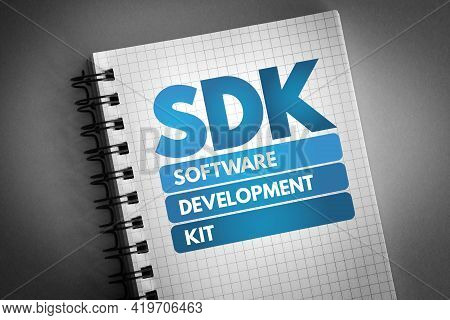 Sdk - Software Development Kit Acronym On Notepad, Technology Concept Background