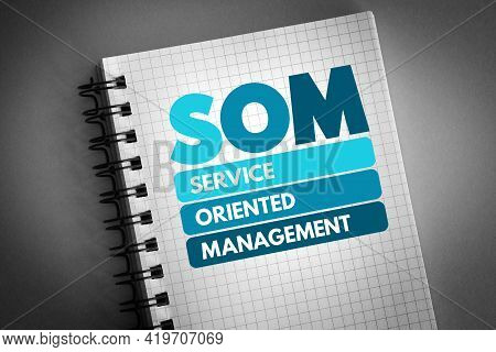 Som - Service Oriented Management Acronym On Notepad, Business Concept Background