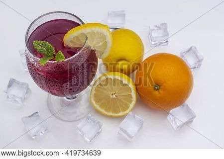 Refreshing Cocktail (red Summer Wine) On White Methacrylate Background. Concept Of Fun And Social Li