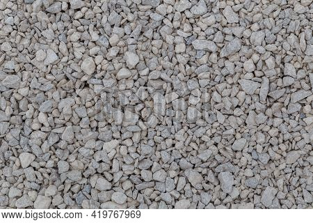 Dry White Limestone Ballast Flat Full Frame Background. Small Gray Dusty Broken Macadam Stones Textu