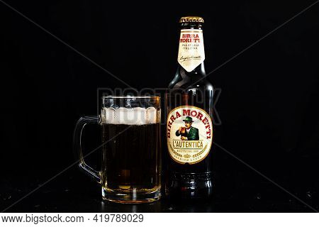 Can Of Birra Morreti Beer And Beer Glass On Dark Background. Illustrative Editorial Photo Shot In Bu