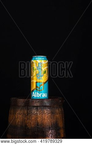 Can Of Albrau Radler Beer On Beer Barrel With Dark Background. Illustrative Editorial Photo Shot In 