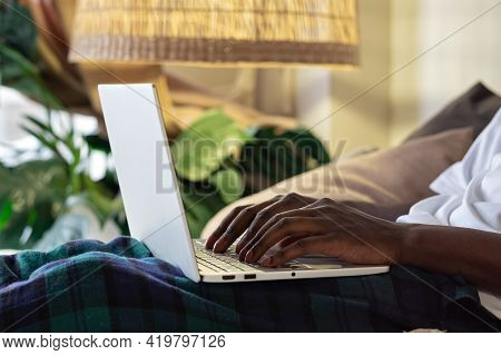 View Shot Of African Male Hands Busy Working On Aptop Sitting At Home.