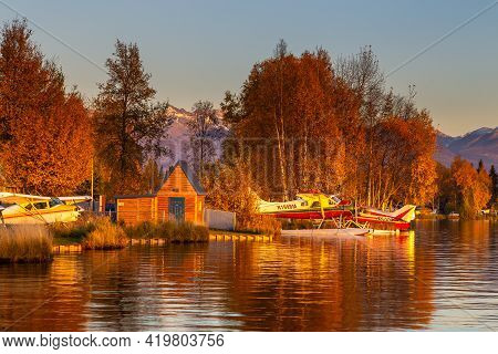 Anchorage, Alaska, Usa - 30 September 2016: Warm Colors Of Sunset At Spenard Lake In Anchorage. Smal