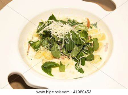 Gnocchi With Cream Sauce In White Dish