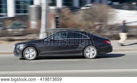 Mercedes-benz Cls-class C218 At The City Road In Motion. Black Car Driving Along The Presnenskaya Na