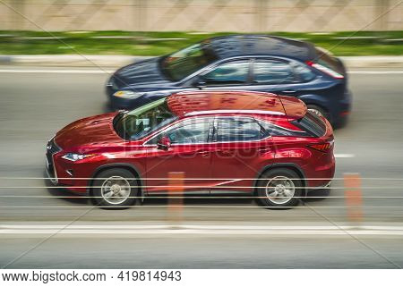 Red Lexus Rx Fourth Generation Al20 Japanese All-wheel Drive Suv On City Road. Aerial Side View Of C
