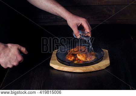 Fajitos, Meat In A Frying Pan With Fire On A Wooden Tray, Beautiful Serving, Dark Background.