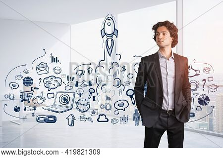 Portrait Of Handsome Businessman With Curly Hair And Hands Inpockets Pondering About Launching Of St