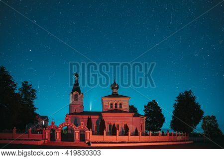 Korma Village, Dobrush District, Belarus. Comet Neowise C2020f3 And Meteor In Night Starry Sky Above