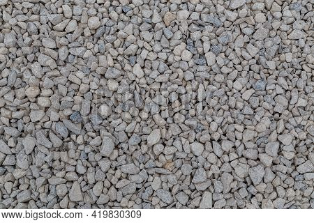Dry White Limestone Ballast Flat Full Frame Background. Small Gray Dusty Broken Macadam Stones Textu