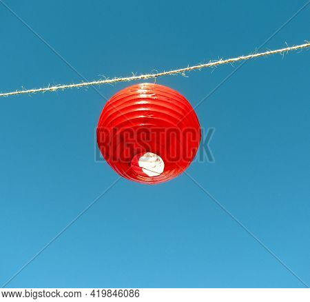 Hanging Chinese Red Lantern Against Blue Sky