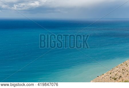 Sea With Turquoise Clear Blue Water And Blue Sky With White Clouds. Cape Aspro Pissouri. Seascape In