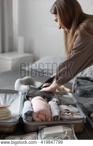 Happy Female Packing Things In Briefcase Use Konmari Method Getting Ready To Travel Or Business Trip