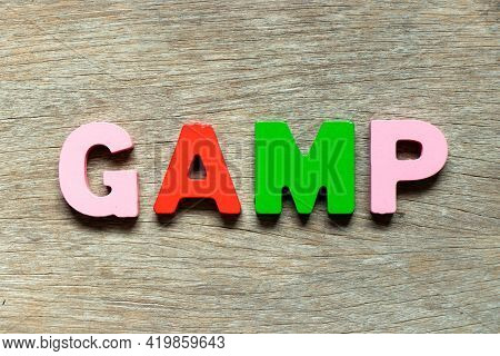 Color Alphabet Letter In Word Gamp (abbreviation Of Good Automated Manufacturing Practice) On Wood B
