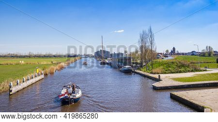 Grou, Netherlands - April 27, 2021: Canal Leading To Grou Village In Friesland, Netherlands