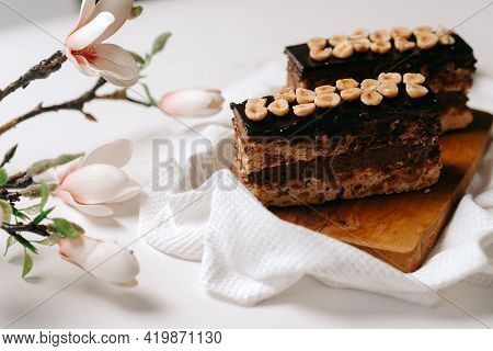 Desert Cake, Chocolate Cake With Hazelnuts On A White Background