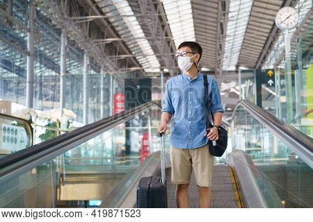 New Normal Tourist Wearing Face Mask Is Traveling On The Airport , New Lifestyle Travel After Covid-