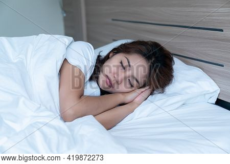 Young Woman Sleeping Cozily
