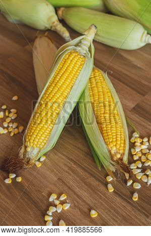 Fresh Ear Of Corn Lay Down On The Table With Corn Kernels. Corn Is A Healthy Food And Versatile Use 
