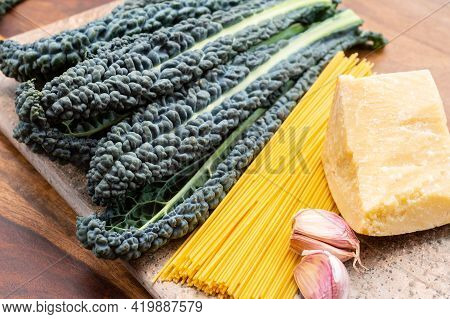 Cooking With Black Flat Leaves Of Cavolo Nero Tuscan Cabbage