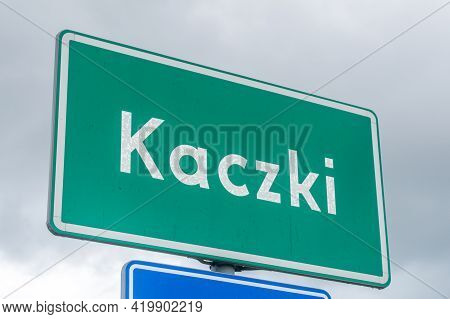 Entrance Kaczki Street Sign To Village Kaczki In Poland.