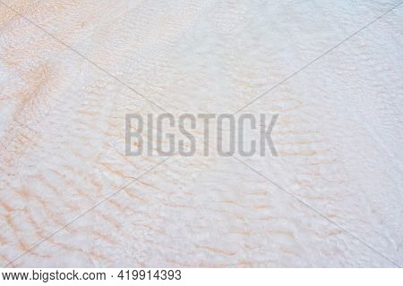 Undulatory Texture Of White Calcite Stalactites Covering A Cascade Of Terraced Baths In Pamukkale, T